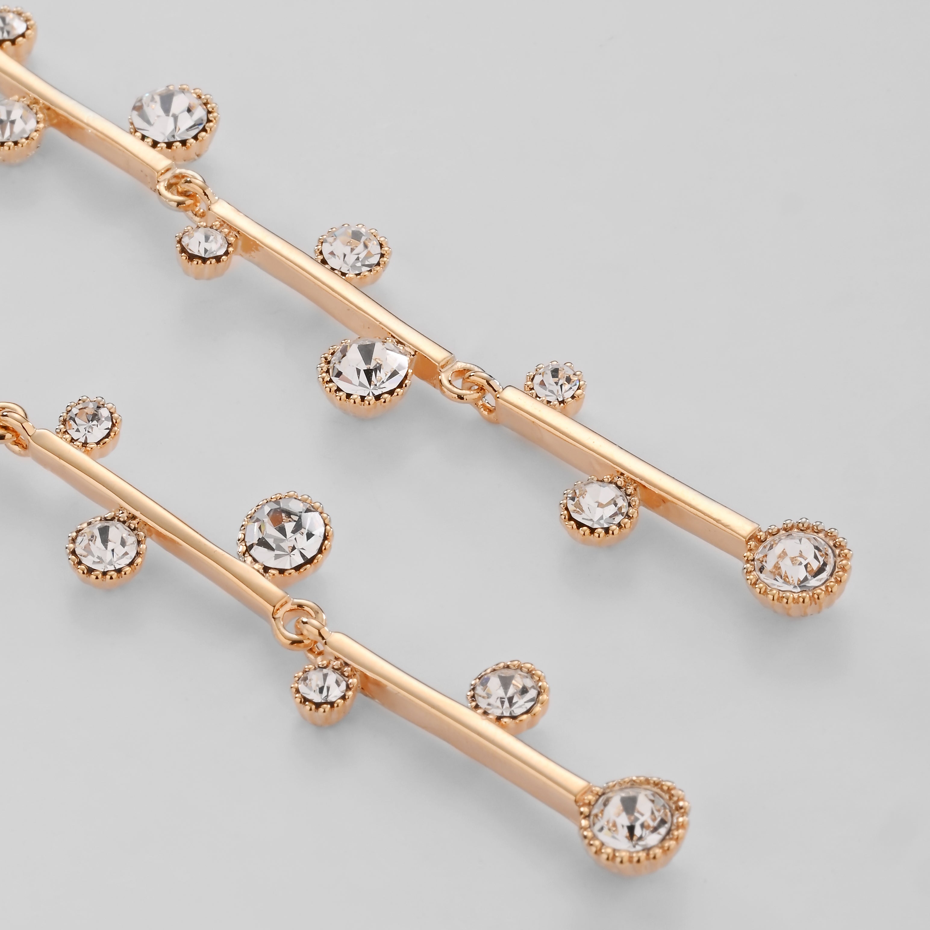 Elegantes pendientes colgantes de cristal dorado