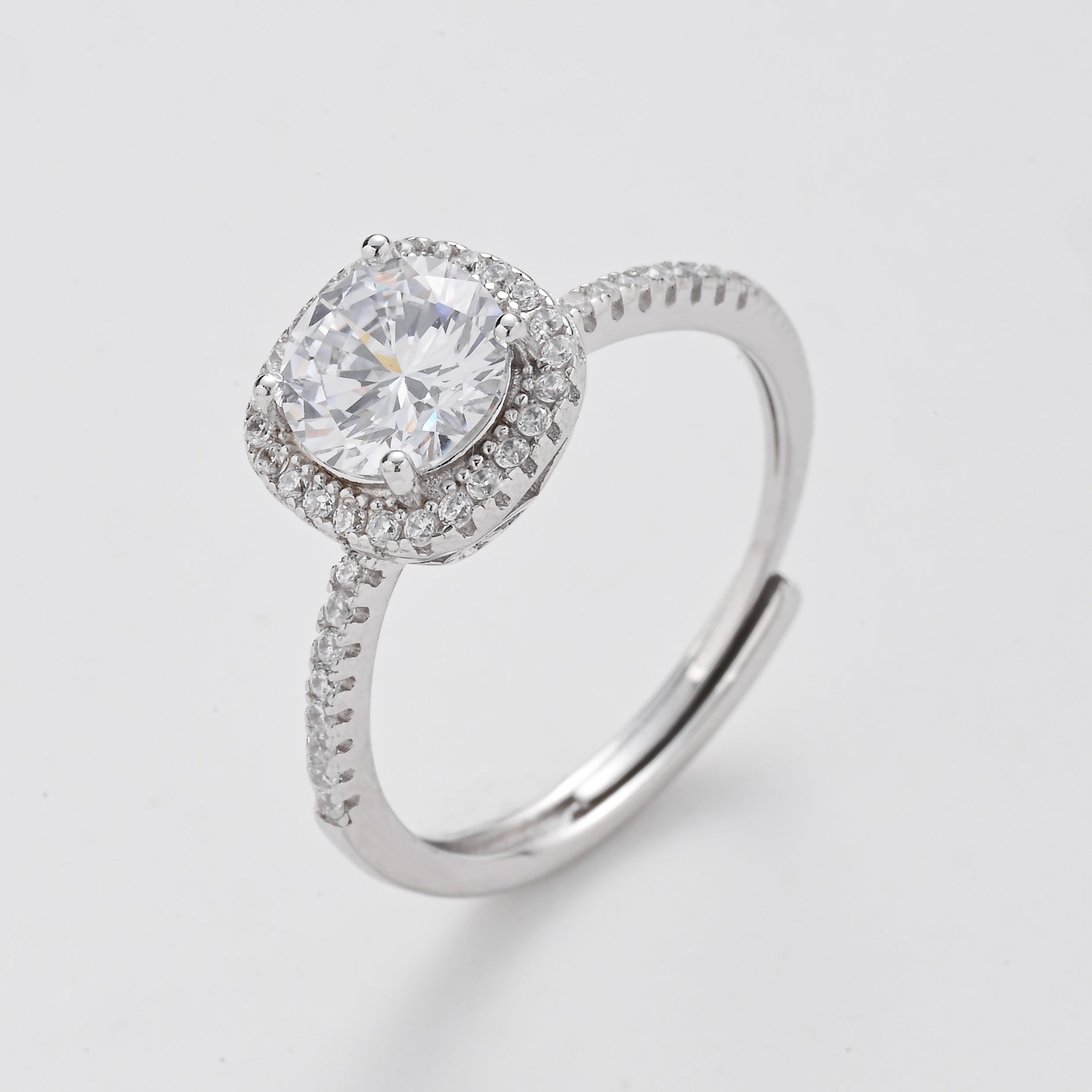 Anillo solitario con halo y corona radiante